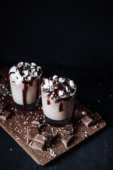 Homemade Hot Chocolate. A cup with hot chocolate, marshmallows and bar chocolate.