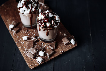 Homemade Hot Chocolate. A cup with hot chocolate, marshmallows and bar chocolate.
