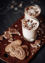 Cup with hot chocolate and chocolate chip cookies. Sweet chocolate dessert. Top view point