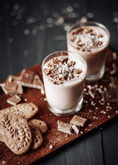 Cup with hot chocolate and chocolate chip cookies. Sweet chocolate dessert. Top view point