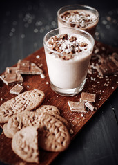 Cup with hot chocolate and chocolate chip cookies. Sweet chocolate dessert