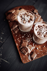 Cup with hot chocolate and chocolate chip cookies. Sweet chocolate dessert. Top view point