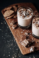 Cup with hot chocolate and chocolate chip cookies. Sweet chocolate dessert. Top view point