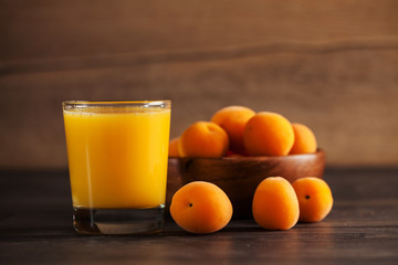 Juice of healthy organic apricots on the old rustic table fresh juice. Selective focus.