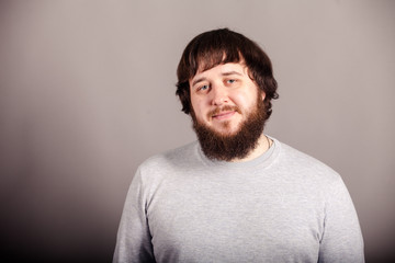 Color portrait of beard man on th gray background