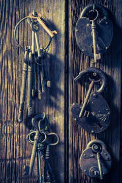 Vintage locks nad keys on old wooden table