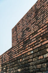 old brick wall and cloudy sky with selective focus