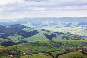 Obraz premium landscape of mountains with trees and grassy valley