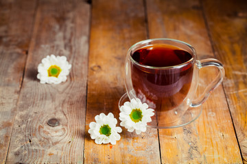 herbal tea with chamomile on a wooden table