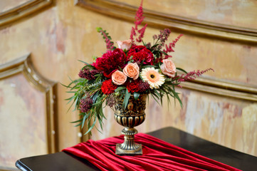 gold vase with flowers