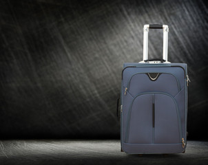Large gray suitcase on wheels