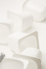 Fototapeta premium Empty crushed plastic yogurt pots