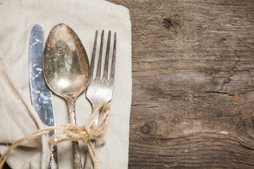 Cutlery on a wooden table. Fork knife and spoon. Tableware. Preparing for dinner