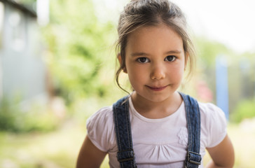 Outdoor portrait of a smiling little girl