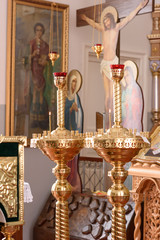 Golden candle in church