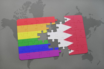 puzzle with the national flag of bahrain and gay rainbow flag on a world map background.