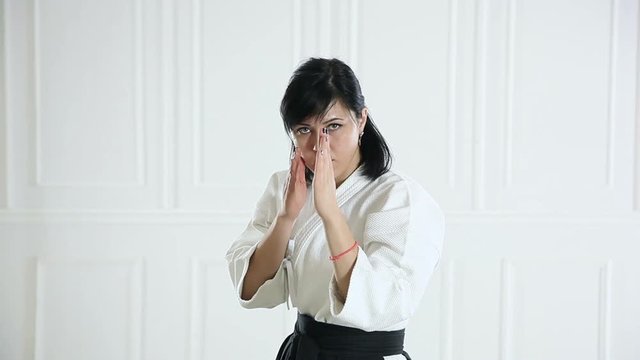 beautiful woman wearing a hakama engaged in Jiu Jitsu
