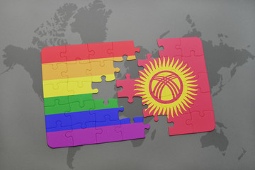 puzzle with the national flag of kyrgyzstan and gay rainbow flag on a world map background.