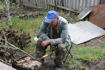 Man cooking catfish