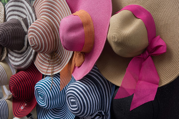 Street market selling hats and souvenirs in the touristic town
