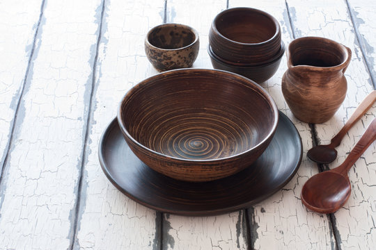 Set of pottery over natural wood background
