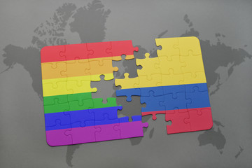 puzzle with the national flag of colombia and gay rainbow flag on a world map background.