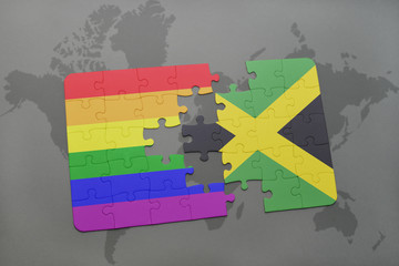puzzle with the national flag of jamaica and gay rainbow flag on a world map background.