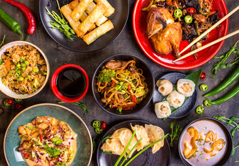 Assorted Chinese food set. Chinese noodles, fried rice, dumplings, peking duck, dim sum, spring...