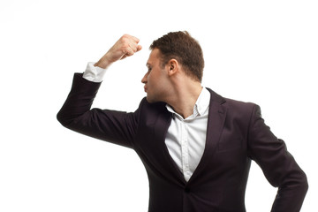 Handsome businessman shows biceps