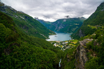 Naklejka na ściany i meble Geiranger fjord, Beautiful Nature Norway. It is a 15-kilometre (9.3 mi) long branch off of the Sunnylvsfjorden, which is a branch off of the Storfjorden (Great Fjord).