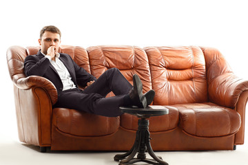 Thinking businessman  holding his chin