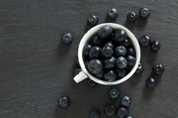 Fototapeta na wymiar blueberries on stone board