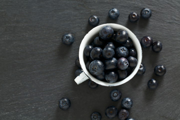 blueberries on stone board