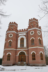 Red brick building with four towers