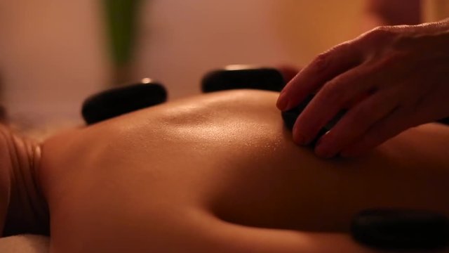Stone therapy massage for a girl.