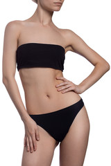 fitness woman in black lingerie isolated on white background hand on waits