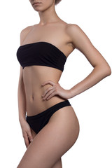 Fototapeta premium fitness woman in black lingerie isolated on white background hand on waits