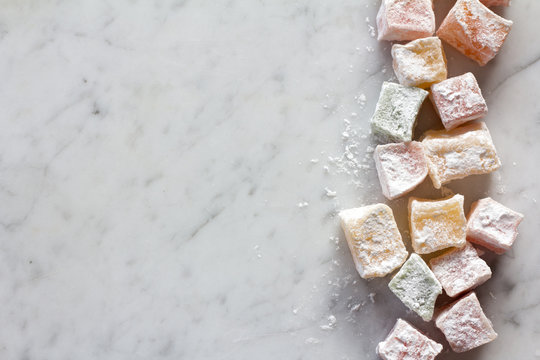 An Assortment of Turkish Delight on Marble Board with Copy Space from Above
