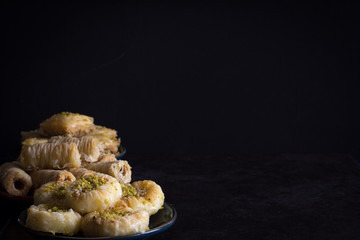 Variety of Baklava Dark on Dark Background Horizontal with Copy Space