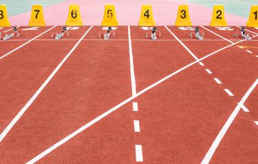 empty running track texture with lane numbers in the stadium 