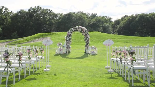 Wedding altar on a green lawn.