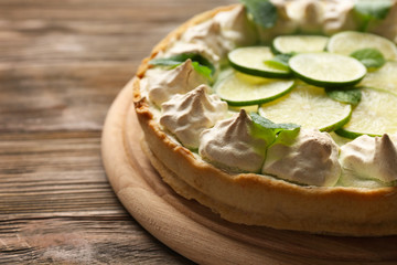 Tasty cake on wooden background