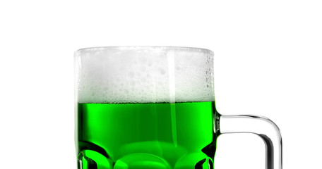 Glass of green beer with handle on white background
