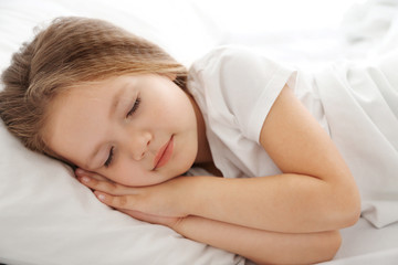 Obraz na płótnie Canvas Adorable sleeping little girl, close up