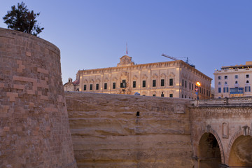 Fototapeta na wymiar The medieval city walls of La Valletta, Malta at sunset 