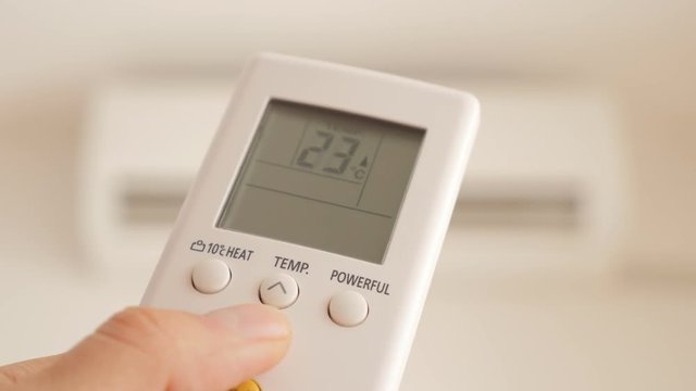 Cooling down room temperature with air conditioner 4K 2160p UHD video - Changing room temperature with AC remote controller 4K 3840X2160 UHD footage 