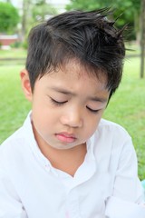 Boy crying in park