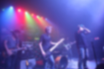 Fototapeta na wymiar Blurred Singer band on stage in pub 
