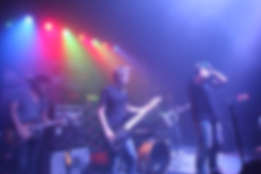 Blurred Singer band on stage in pub 