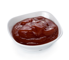 Bowl of tomato sauce sauce on white background